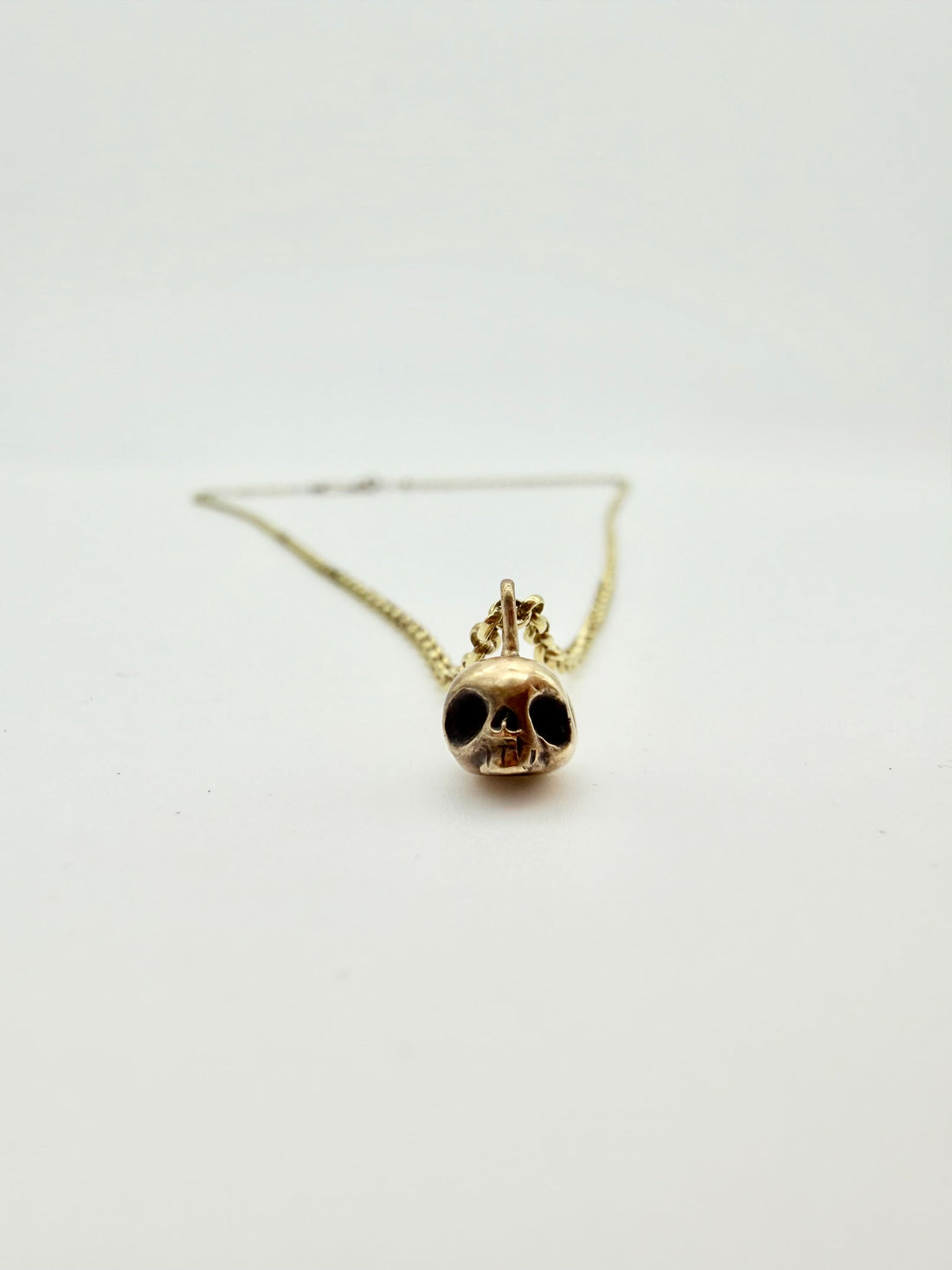 Gold skull necklace