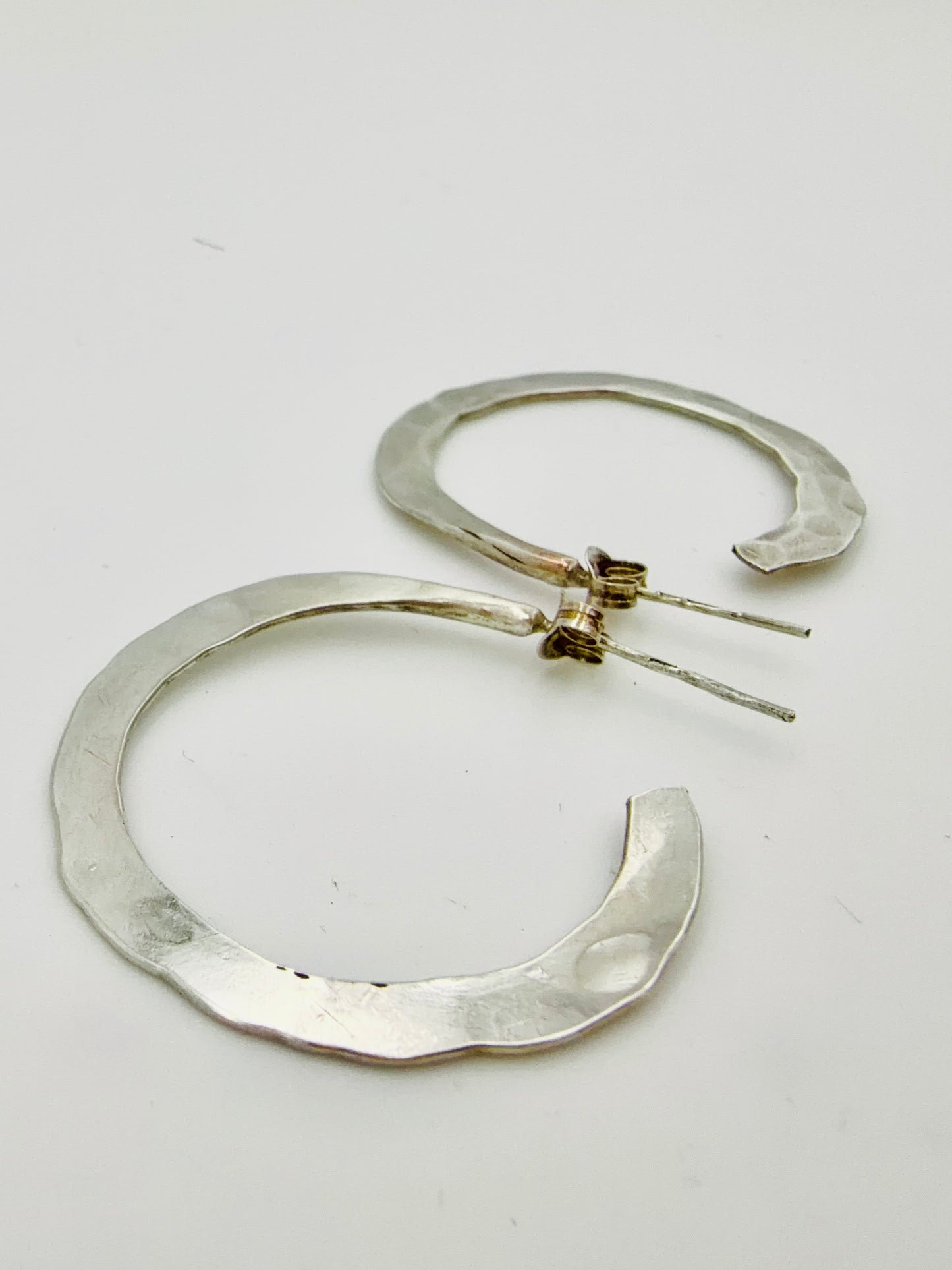 Hammered sterling silver hoop earrings — handmade by Virginia Allan