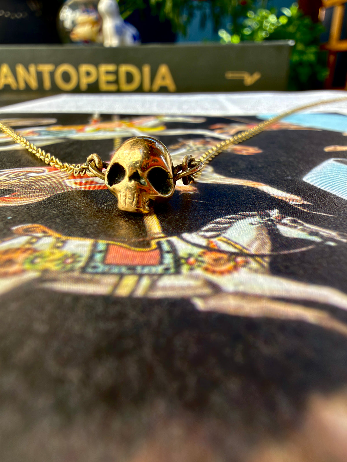 A handmade 9ct gold skull necklace by Virginia Allan — luxury dark gold jewellery hallmarked in London