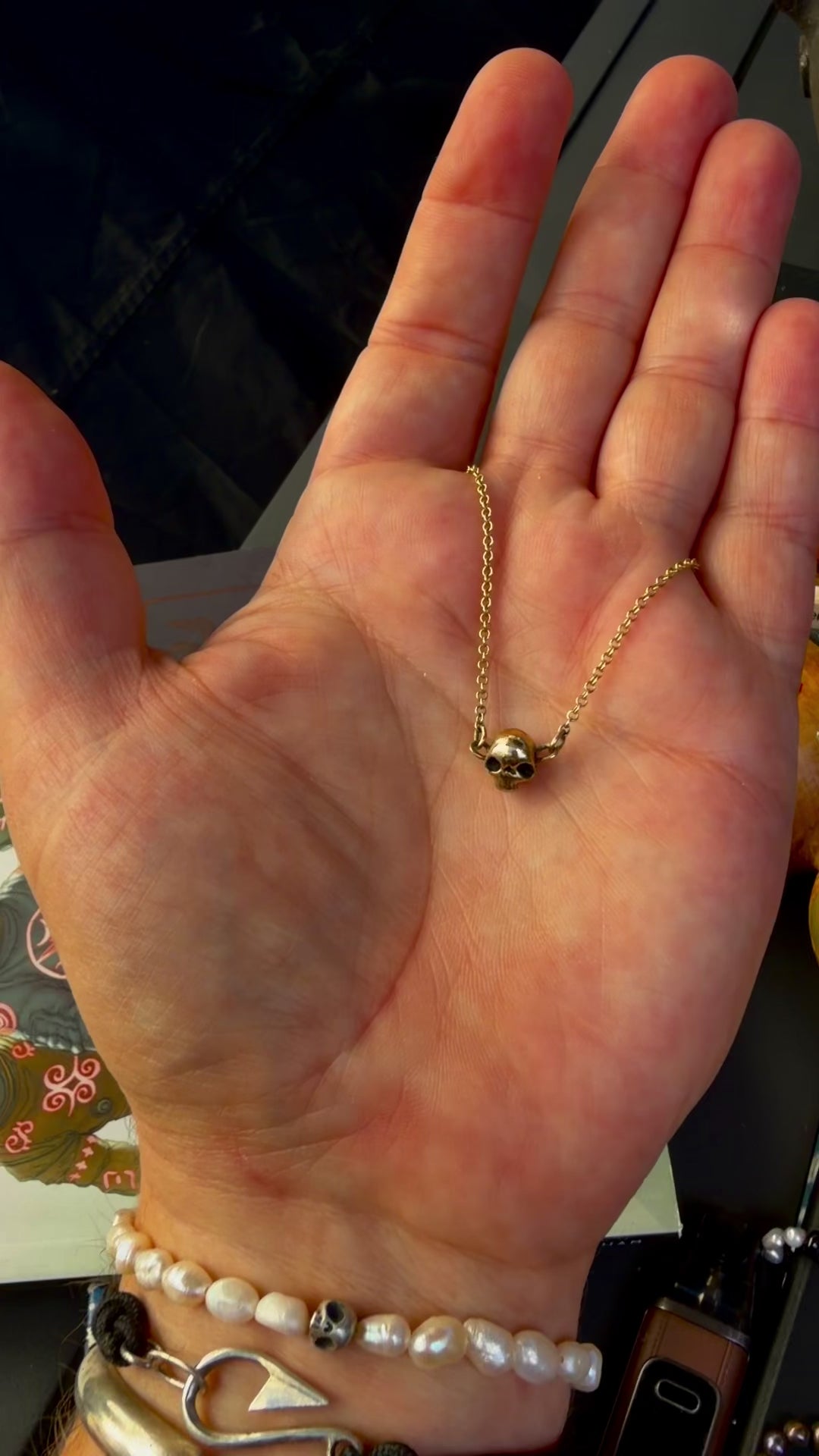A handmade 9ct gold skull forward necklace by Virginia Allan — luxury dark gold jewellery hallmarked in Hastings